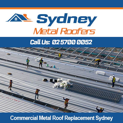 Workers installing metal roof on large commercial building in Sydney